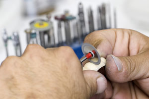 grinding dentures with a rotary disc