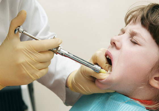 dentist administering local anesthetic